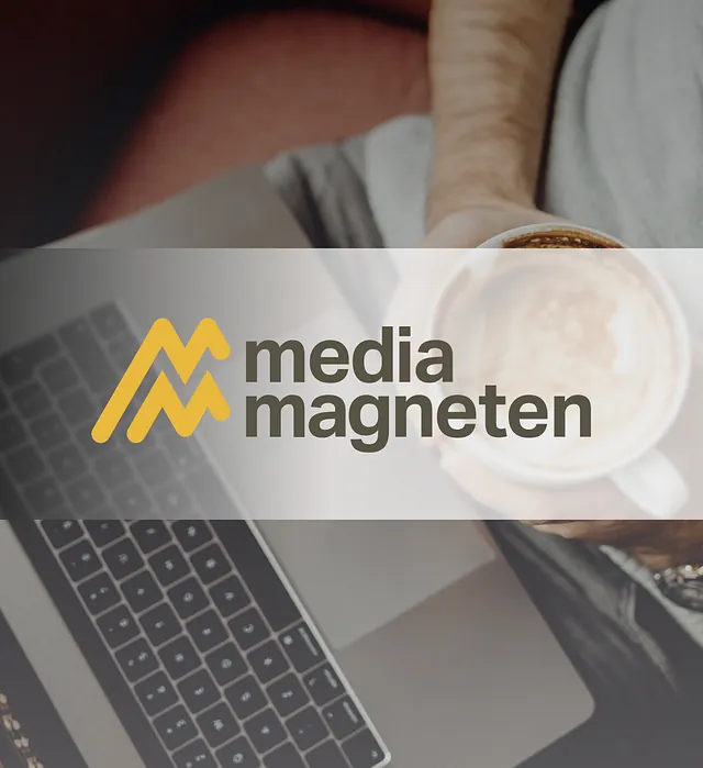 Mediamagneten's logo on a background image of a computer